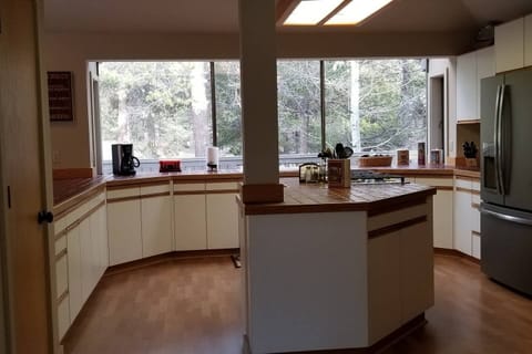 Large kitchen with lots of counter space,  Looking out to golf course.