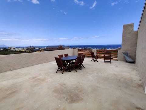 large open terrace with stunning views of the coast and mountains