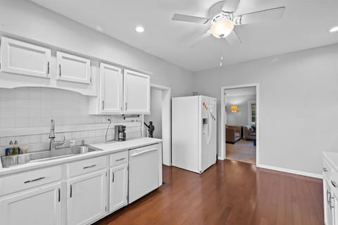 The kitchen is fully equipped, dishwasher, microwave, and range