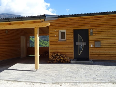 The front door and carport, with access to the utility room