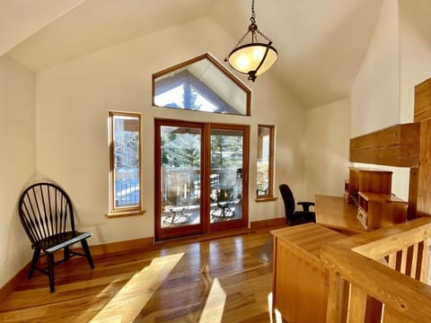 Home office with monitor, hub, mouse, and keyboard.