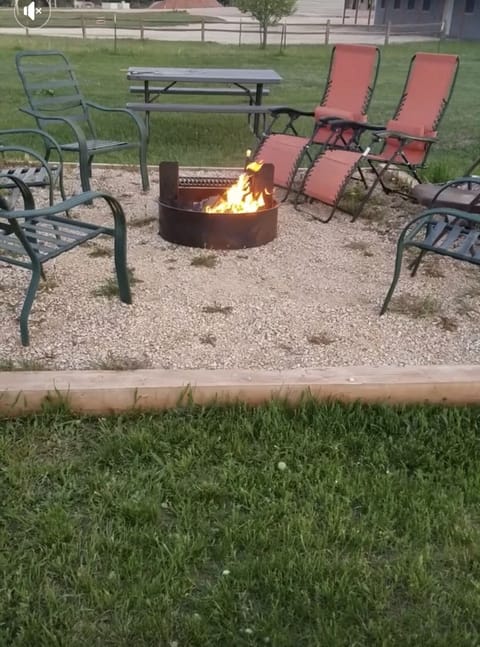 The community firepit is located toward the front of the property.