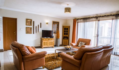 Our living room features natural lighting and bespoke comfort. 