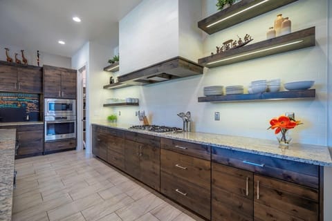 Large kitchen stocked with utensils and appliances for cooking