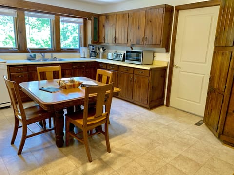 Eat-in kitchen includes coffee maker, toaster oven, microwave.