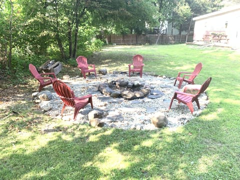 Fire pit and .66 acre lot extends on both sides of house