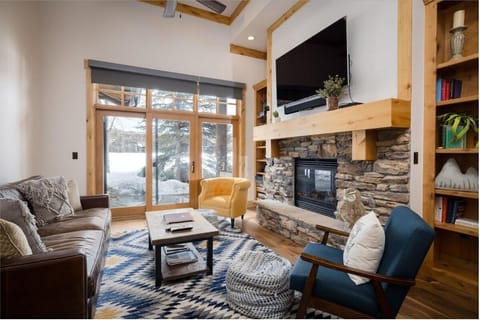 Gather by the stone fireplace for cozy movie nights.