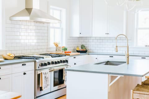 Chefs kitchen with new stainless steel appliances