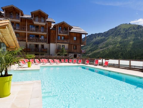 Lounge by the pool in the sunshine.