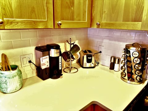 Coffee/latte maker, toaster, salt, pepper, and spices