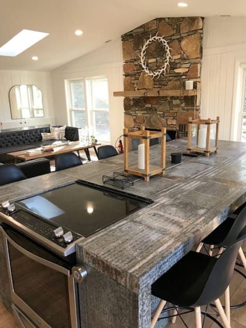 Kitchen island with inset cook top and convection oven.