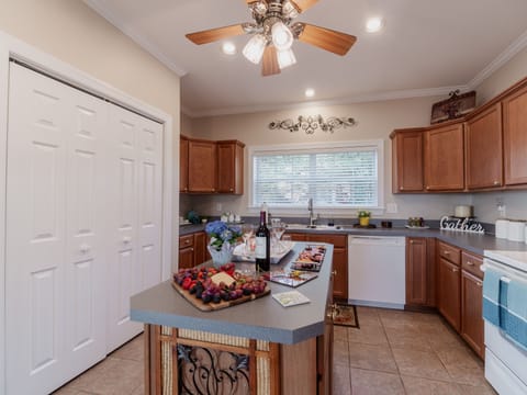 Functional, well stocked kitchen with island for entertaining , double pantry