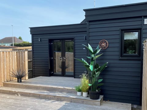 Secluded decking area to the rear of the cottage | Mile End Cottage, Inverness