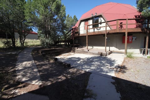 Parking pad and path to steps to front door.