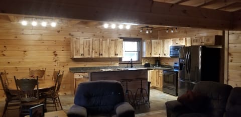 Open kitchen, dining, and living