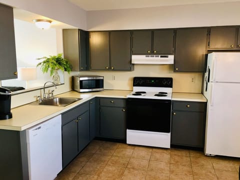 Full size kitchen with cookware, dishware, and glassware.