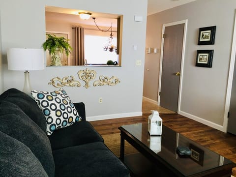 Living room with view into the kitchen.