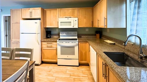 Full Kitchen – Stocked with the essentials you need to cook meals at home.