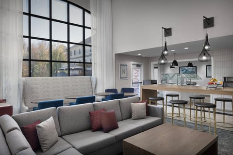 Relax and unwind in the plush seating, surrounded by natural light and stylish decor.