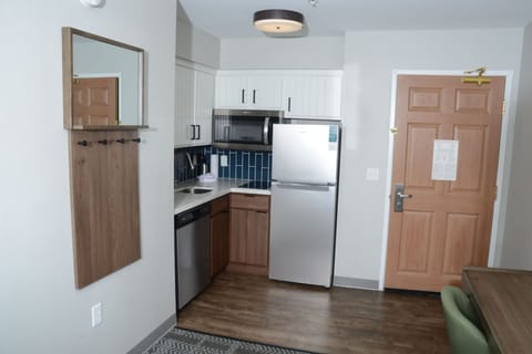 Modern kitchen equipped with stainless steel appliances and cabinetry.