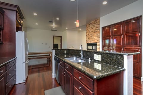 Kitchen looking to kitchen table and Master