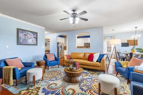 Living room with fireplace, and view of the pool