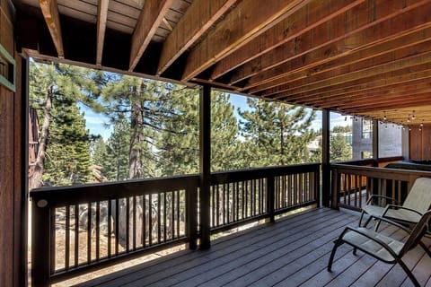 A spacious covered balcony, perfect for taking in the mountain views.
