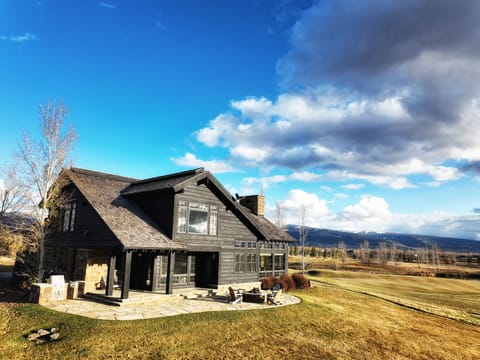 Wake up to breathtaking mountain vistas from this stunning rustic retreat, where your mornings begin with endless blue skies and rolling countryside stretching to the horizon.