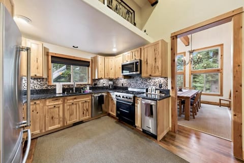 Our spacious kitchen features a gas range, dishwasher, and is fully equipped for all your culinary needs.