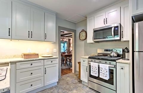 New gas range, stainless microwave, custom cabinets/countertops maximize space!