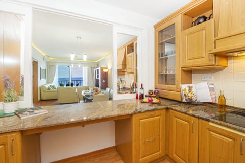 fully equipped kitchen with window overlooking the dining area
