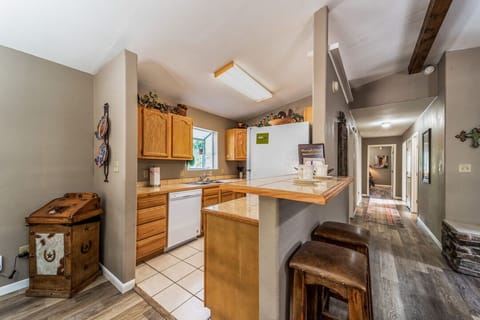 Kitchen entrance with bar seating