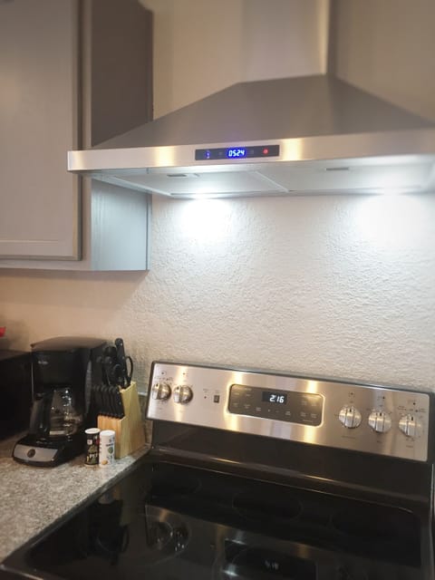 Full size electric range with oven and outside vented hood
