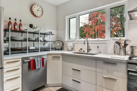 Views out the window are tree tops and a beautiful Oak and a large Maple