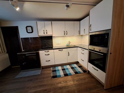 Cabinetry, Countertop, Drawer, Wood, Flooring, Kitchen, Floor, Interior Design, Home Appliance, Wood Stain