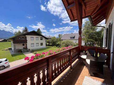 Sky, Flower, Cloud, Building, Plant, Property, Window, Fence, Tree, Wood