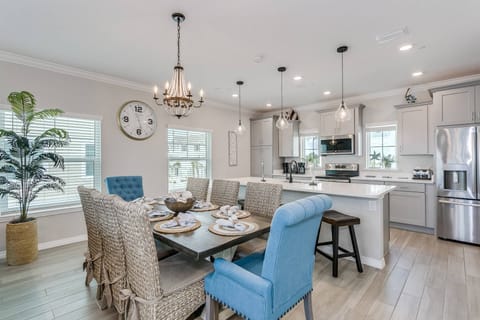 Room for eight at the dining table and four additional seating options at the kitchen bar counter