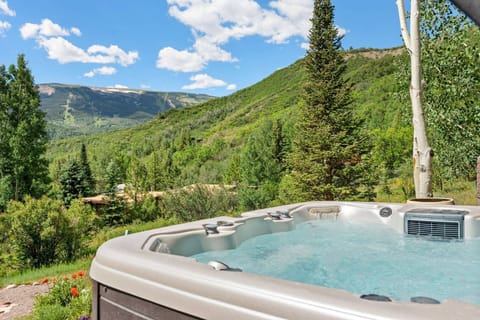 The Snowmass Mountain ski trails are visible from your private hot tub.