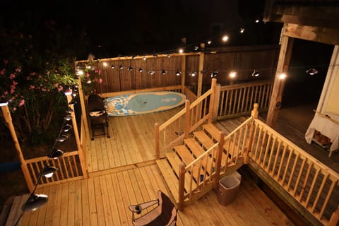 Deck at night with lights on taken from the 2nd floor landing.