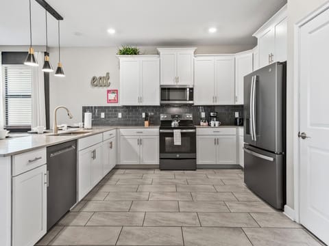 Savor the joy of cooking in our open-concept kitchen, fully equipped for preparing and serving every delightful dish.