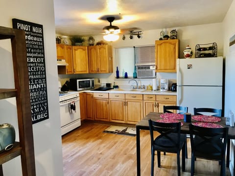 Kitchen (complete with all cookware and dishes) from hallway
