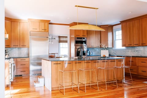 The stocked kitchen has two stoves and plenty of room to gather