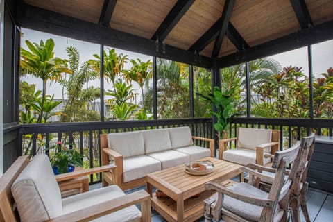 Gather for open-air cocktails on the private lanai, surrounded by lush island greenery.