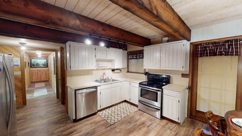 Full size open kitchen with appliances, pots and pans, cookware, dishes, and basic cooking essentials.