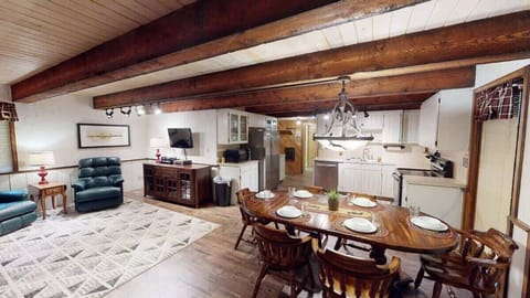 Upon entrance you are greeted by the dining area, living room, and kitchen.