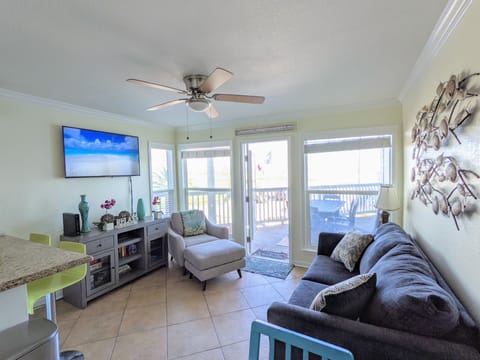 Light & airy living room with full-sized sofa bed. Direct ocean views.