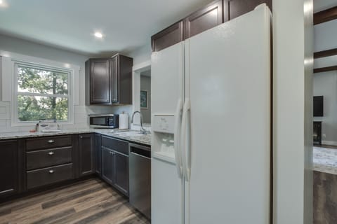 Full size refrigerator with ice maker, double sink, and dishwasher