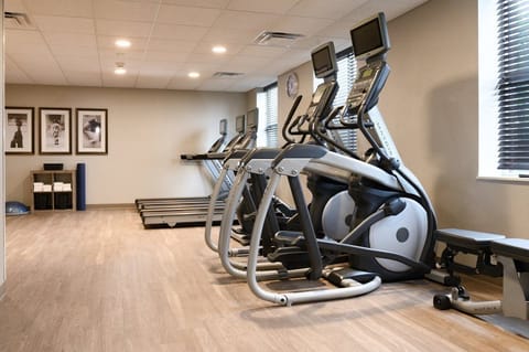 The modern fitness center is equipped with state-of-the-art exercise machines, offering guests a convenient place to maintain their workout routines.