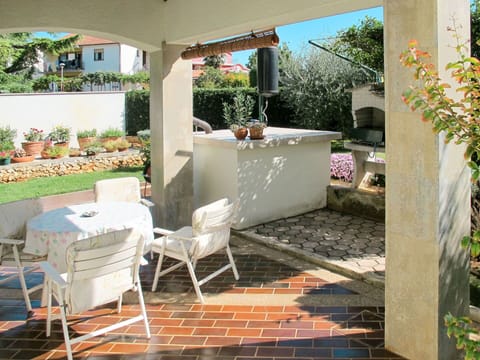 Plant, Property, Furniture, Shade, Chair, Interior Design, Outdoor Furniture, Architecture, Building, Floor