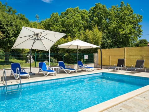 Water, Plant, Property, Sky, Furniture, Swimming Pool, Umbrella, Blue, Chair, Azure